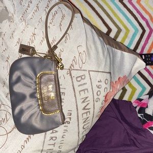 Authentic coach wristlet worn only few times still looks new dm me for more pix